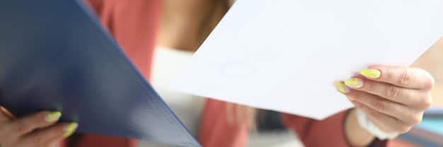 A close-up shot of a document related to social benefits in the AE, with emphasis on the words 